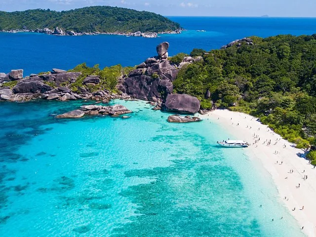 Aerial view of white sand beach and Sailing Boat Rock