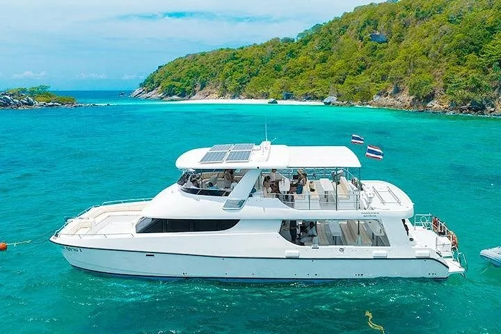Catamaran boat anchored in turquoise water near Similan Islands
